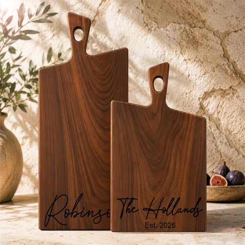 Walnut charcuterie boards with natural wood grain, ready for serving and gifting