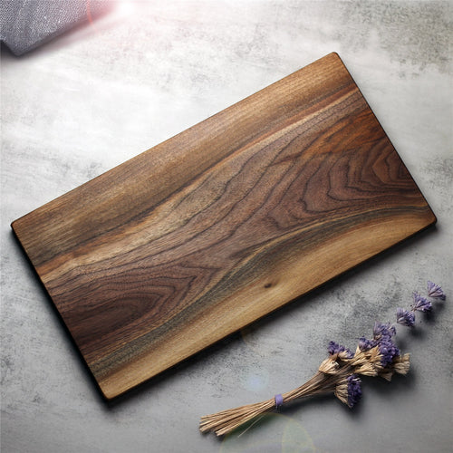 Walnut cutting board made from one solid piece, showing its natural grain and lighter sapwood